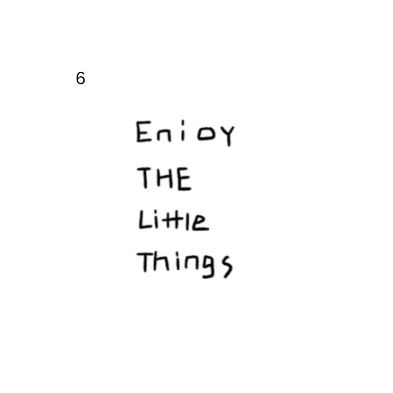 Temporary tattoo reading “Enjoy the little things” in handwritten lettering