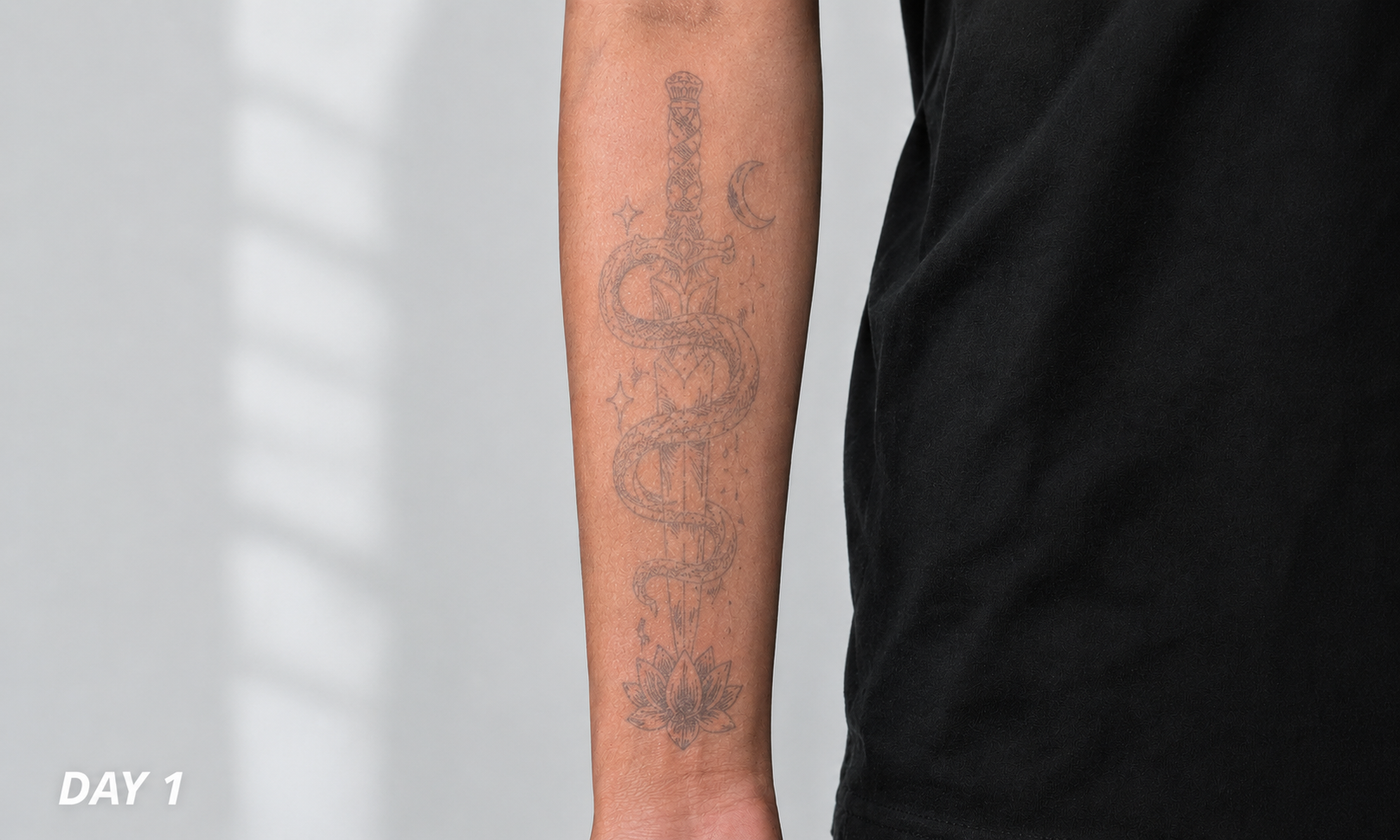 Day 1 light temporary tattoo effect on forearm with sword and snake design
