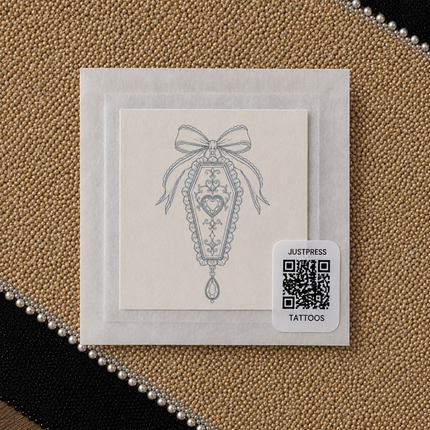 Coffin Bow Charm Wrist Temporary Tattoo - JUST PRESS physical packaging image