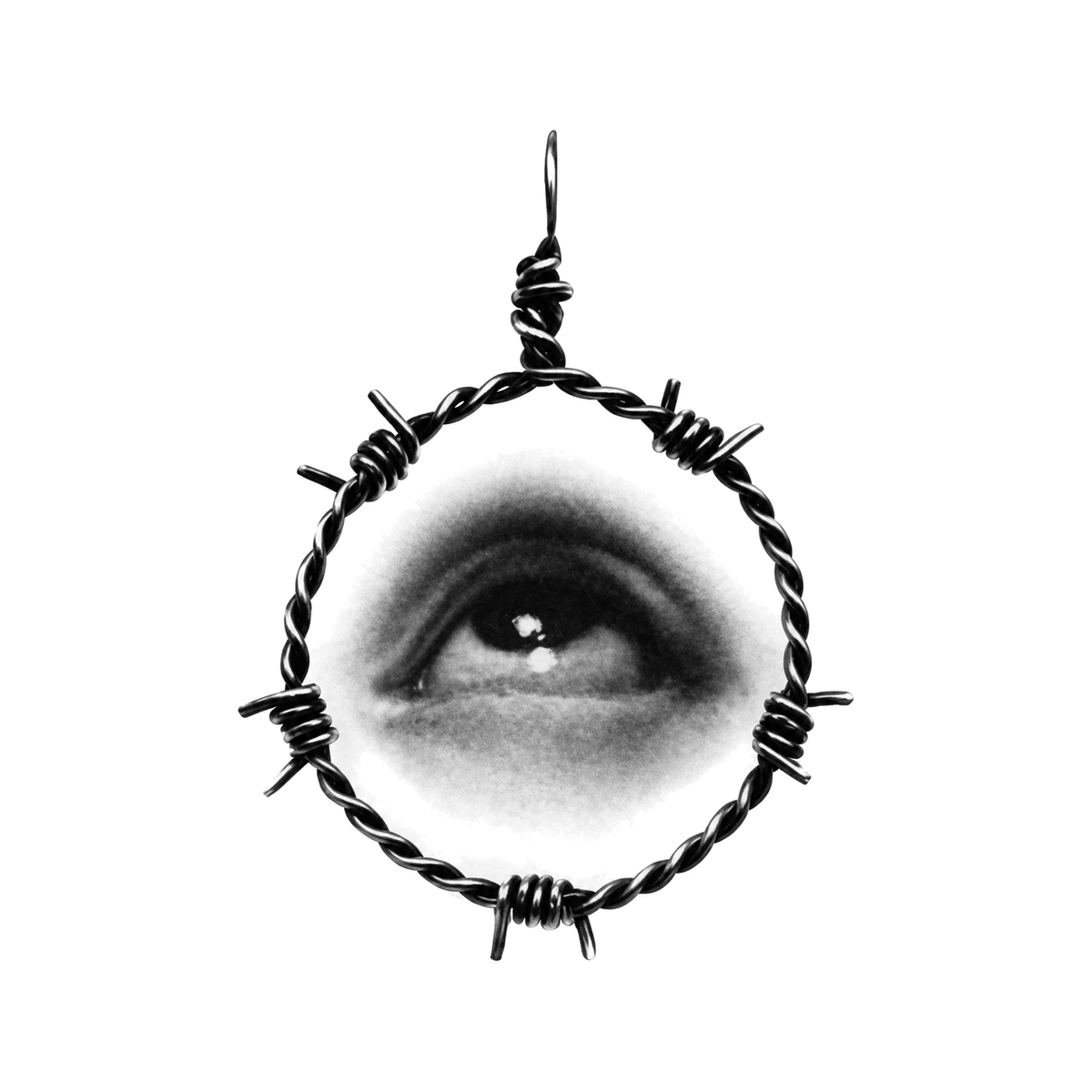 The image shows barbed wire eye pendant in a centered arrangement, with eye clearly defining the visible design.