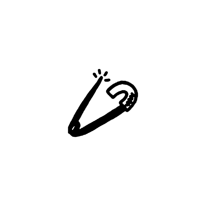 A closed safety pin sits at an angle with four short radiating marks beside its pointed end.