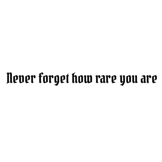 Temporary tattoo reading “never forget how rare you are” in condensed gothic lettering